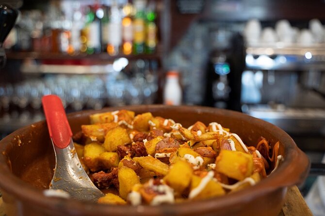 Madrid by Night: Tapas Crawl, Local Drinks & Hidden Gems - Stop 3: La Latina—small tables, big appetite