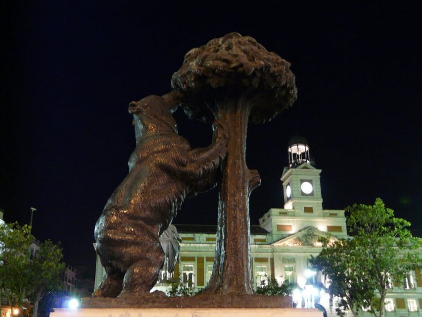 Madrid: Enchanted Evening Walking Tour in Spanish - Puerta del Sol: Community Origins and the City’s Center Pulse