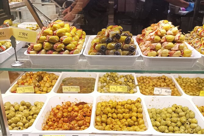 Madrid Food Tour: Tapas, Drinks and Delights with a Local - Stop 4: Murales de Antonio Mingote and Spanish cured meats