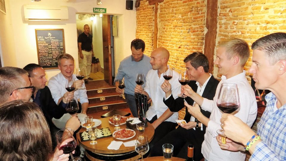 Madrid: Iberico Ham and Spanish Wine Small-Group Food Tour - Jamonerías 101: serrano vs Ibérico, jamón vs paletilla