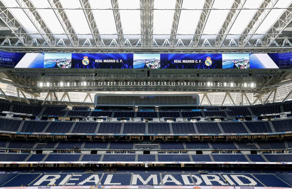 Madrid: Santiago Bernabéu and Real Madrid Guided tour - Into the stadium heart: benches, dugouts, and the locker room