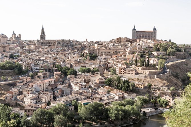 Panoramic Madrid Tour and Toledo Half-Day Trip from Madrid - Temples, plazas, and quick photo stops (Debod, Plaza Mayor, Sol)