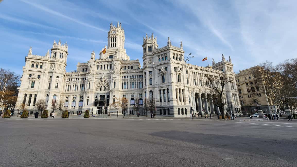 Tour Madrid: Secrets in a Electric Tuk Tuk - Plaza de España: Miguel de Cervantes and the towers that frame the square